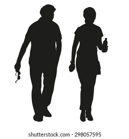 Silhouette of an elderly couple on a walk