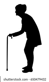 Silhouette of an Elderly woman with bent back walking with cane