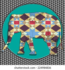 silhouette of an elephant with floral patterns.