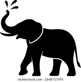 silhouette of elephant playing with water