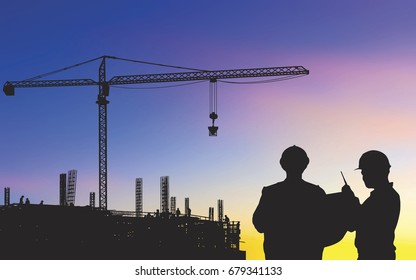 Silhouette of engineer and foreman working control in sunset at construction site