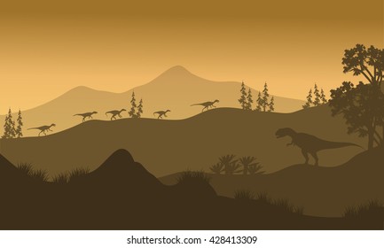Silhouette of Eoraptor and Allosaurus at the sunrise