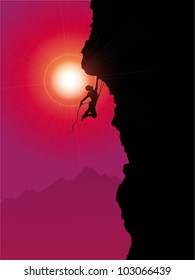 Silhouette of an extreme rock climber
