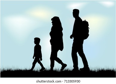 Silhouette family on a walk.
