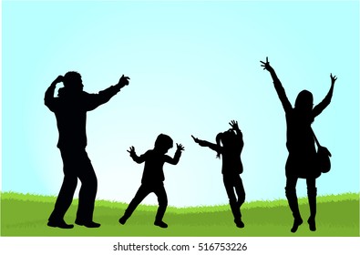 Silhouette family playing on the grass.