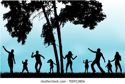 Silhouette family playing on the grass.