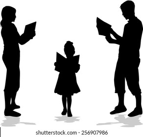 Silhouette of a family reading a book