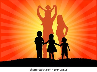 Silhouette of family at sunset 