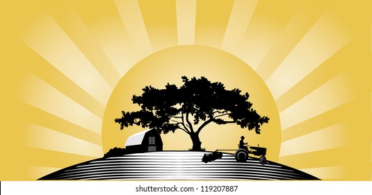 Silhouette of farmer driving tractor harrowing field at sunset with oak tree and barn background