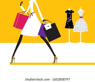 Silhouette of the fashion woman holding the bags walking in the shopping store mall.