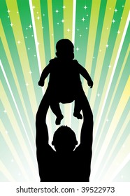 Silhouette of the father of  holding child on hands