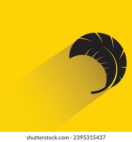 silhouette feather icon with shadow on yellow background