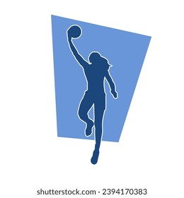 Silhouette of a female athlete doing basket ball pose. Silhouette of a woman basket ball player in action pose.