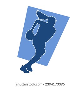 Silhouette of a female athlete doing basket ball pose. Silhouette of a woman basket ball player in action pose.