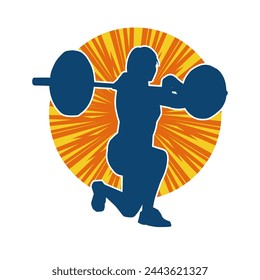 Silhouette of female athlete doing weight lifting sport