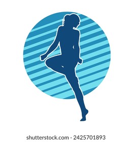 Silhouette of a female ballet dancer in action pose. Silhouette of a ballerina girl dancing pose.