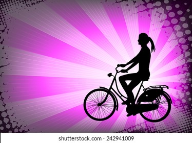 silhouette of female bicyclist on the abstract purple background