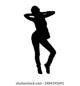 Silhouette of a female dancer in action pose. Silhouette of a slim woman in dancing pose.