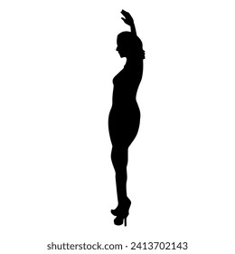 Silhouette of a female dancer in action pose. Silhouette of a slim woman in dancing pose.