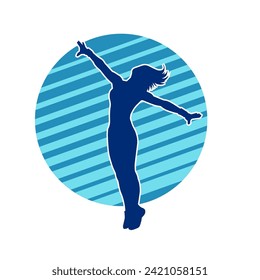 Silhouette of a female dancer in action pose. Silhouette of a slim woman in dancing pose.