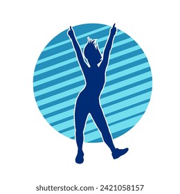 Silhouette of a female dancer in action pose. Silhouette of a slim woman in dancing pose.