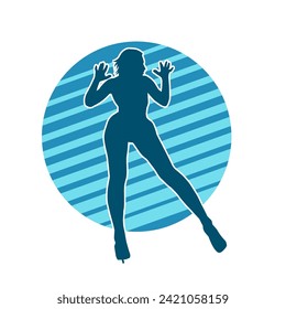 Silhouette of a female dancer in action pose. Silhouette of a slim woman in dancing pose.