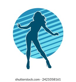 Silhouette of a female dancer in action pose. Silhouette of a slim woman in dancing pose.