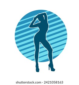 Silhouette of a female dancer in action pose. Silhouette of a slim woman in dancing pose.