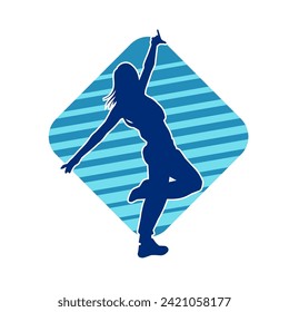 Silhouette of a female dancer in action pose. Silhouette of a slim woman in dancing pose.