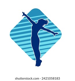 Silhouette of a female dancer in action pose. Silhouette of a slim woman in dancing pose.