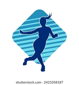 Silhouette of a female dancer in action pose. Silhouette of a slim woman in dancing pose.