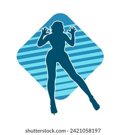 Silhouette of a female dancer in action pose. Silhouette of a slim woman in dancing pose.