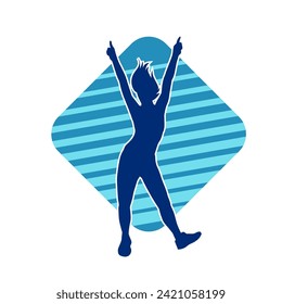 Silhouette of a female dancer in action pose. Silhouette of a slim woman in dancing pose.