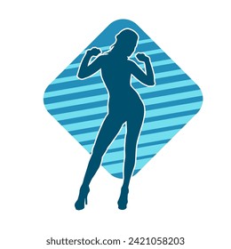 Silhouette of a female dancer in action pose. Silhouette of a slim woman in dancing pose.