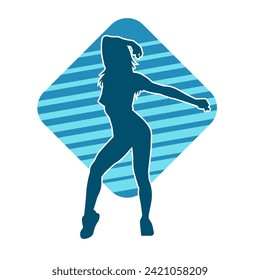 Silhouette of a female dancer in action pose. Silhouette of a slim woman in dancing pose.