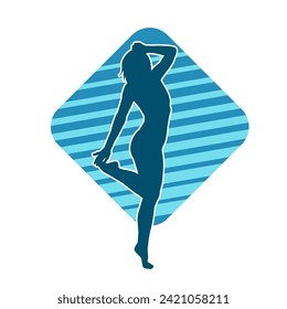 Silhouette of a female dancer in action pose. Silhouette of a slim woman in dancing pose.