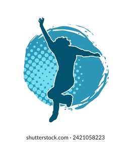 Silhouette of a female dancer in action pose. Silhouette of a slim woman in dancing pose.