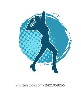 Silhouette of a female dancer in action pose. Silhouette of a slim woman in dancing pose.