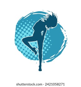 Silhouette of a female dancer in action pose. Silhouette of a slim woman in dancing pose.