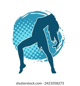 Silhouette of a female dancer in action pose. Silhouette of a slim woman in dancing pose.