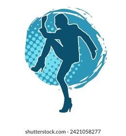 Silhouette of a female dancer in action pose. Silhouette of a slim woman in dancing pose.