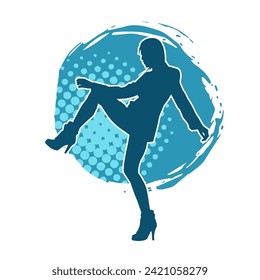 Silhouette of a female dancer in action pose. Silhouette of a slim woman in dancing pose.