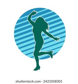 Silhouette of a female dancer in action pose. Silhouette of a slim woman in dancing pose.