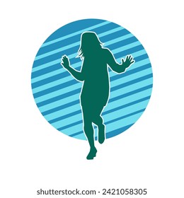 Silhouette of a female dancer in action pose. Silhouette of a slim woman in dancing pose.