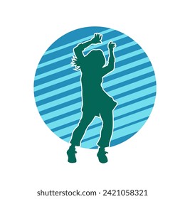 Silhouette of a female dancer in action pose. Silhouette of a slim woman in dancing pose.