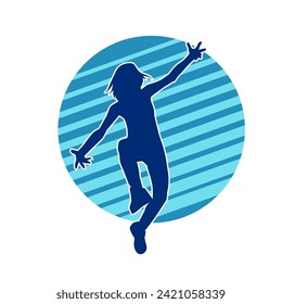 Silhouette of a female dancer in action pose. Silhouette of a slim woman in dancing pose.