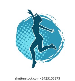 Silhouette of a female dancer in action pose. Silhouette of a slim woman in dancing pose.