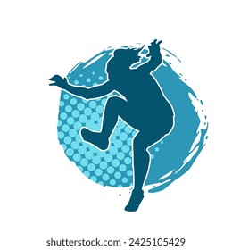 Silhouette of a female dancer in action pose. Silhouette of a slim woman in dancing pose.