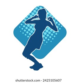 Silhouette of a female dancer in action pose. Silhouette of a slim woman in dancing pose.