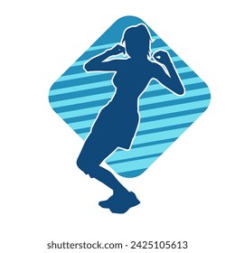 Silhouette of a female dancer in action pose. Silhouette of a slim woman in dancing pose.